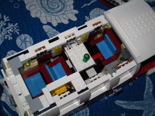 The brown and blue bench seats do fold back, almost flat like beds.